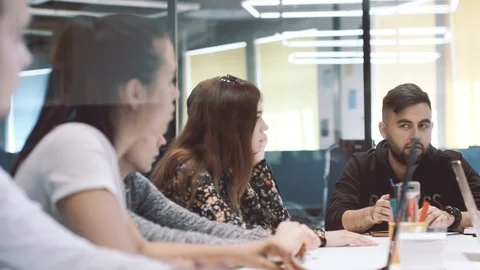 Young creative business team working together in a light contemporary office. Video stock 98296525