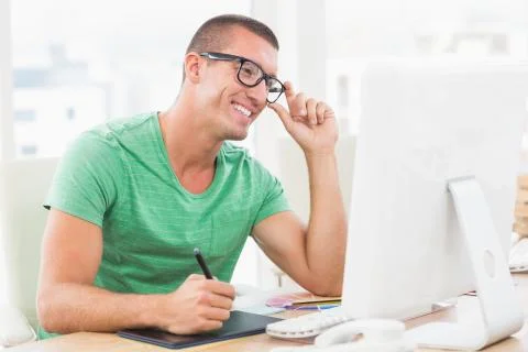 Young creative businessman typing on the computer Stock Photos