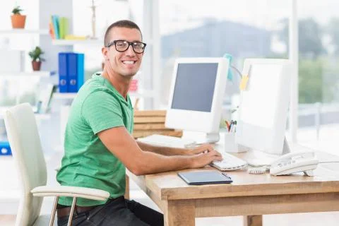 Young creative businessman typing on the computer Stock Photos