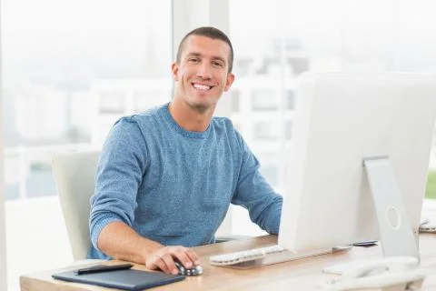 Young creative businessman working on the computer Foto stock