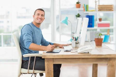 Young creative businessman working on the computer Foto stock