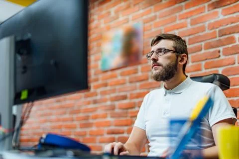 Young creative designer working on startup business in his office Stock-Fotos