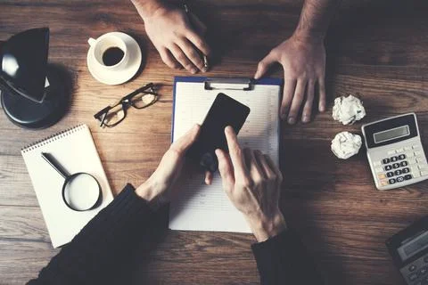 Young creative designers working on project together Stock Photos