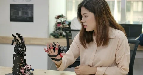 Young creative engineer testing robotic technology in laboratory. Stock Footage 111851124