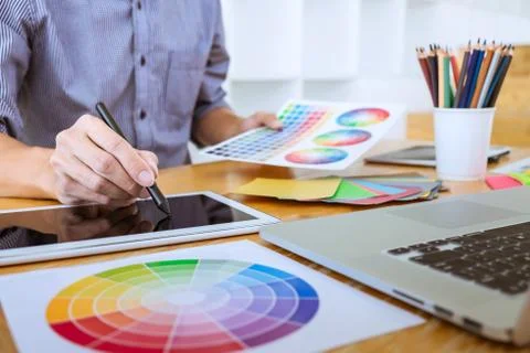 Young creative graphic designer working on project architectural drawing and Foto stock