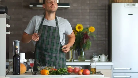 Young creative hipster couple dancing together in the kitchen at home. Fancy Stock Footage 96686695