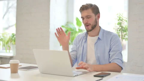 Young Creative Man Talking on Video Call on Laptop Stock Footage 156864170