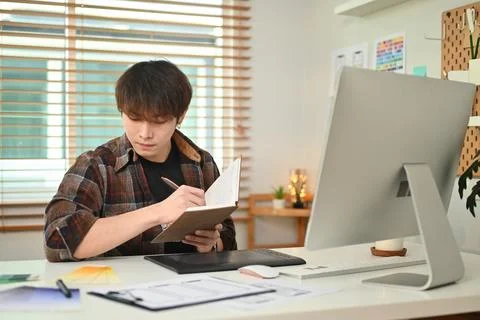 Young creative man using digital tablet, working on application template layout Stock Photos