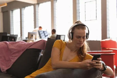 Young creative professionals working in a sunlit office Stock Photos