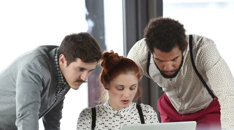 Young creative team discussing plans in office meeting Stock Footage 59542791