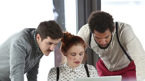 Young creative team discussing plans in office meeting Stock Footage 59542801