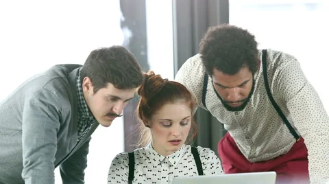 Young creative team discussing plans in office meeting Stock Footage 59542815