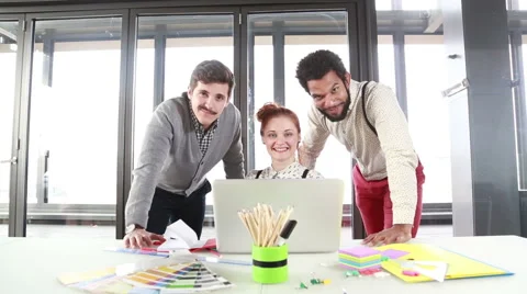 Young creative team smiling and looking at camera Stock Footage 59543910