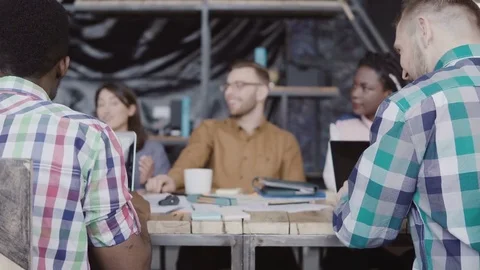 Young creative team working at modern office. Mixed race group business meeting Stock Footage 75219545