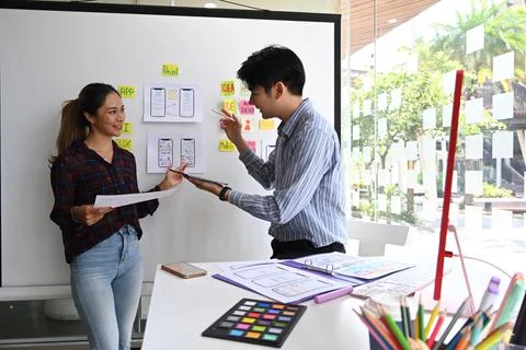 Young creative team working together for mobile application software design Stockfoto's
