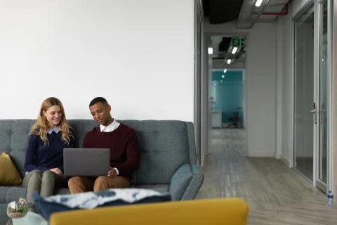 Young creatives working in a modern office Photos