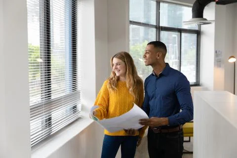 Young creatives working in a modern office Stockfoto's