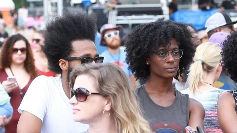 Young crowd of african american dancing at an open-air music festival in summer Stock Footage 73497591