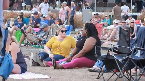 Young crowd african american setting at an open-air music festival in summer Stock Footage 73497705