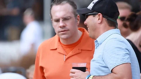 Young crowd man drinking beer at an open-air music festival in summer Stock Footage 73495913