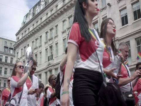 Young crowd is marching on Gay Parade Pride London LGBT 스톡 동영상 77656091