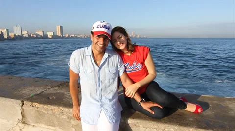 Young Cuban Couples smiling and  waving to camera Stock Footage 38763388
