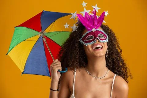 Young curly hair woman celebrating the Brazilian carnival party with Frevo um Stock Photos