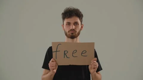 A young curly-haired man opposes oppression, war and occupation. A man in a Stock Footage 236855592