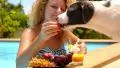 Young Curly Woman and Cute Funny Dog Relaxing at Swimming Pool. Funny Video. HD Footage