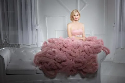 Young cute blonde posing in studio. Stock Photos