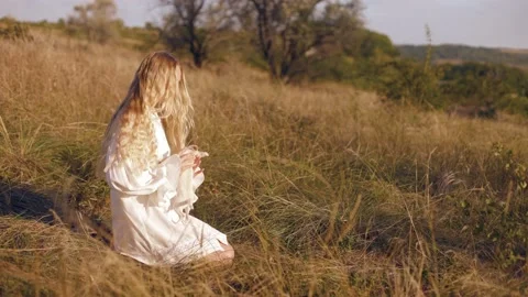Young cute long-haired blonde woman girl playing with her chihuahua white dog Stock-Footage 236559293