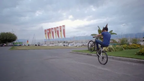 Young cyclist man wheeling Stock Footage 77826848