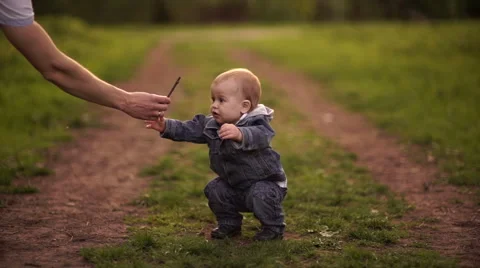 Young dad walking with his son in the park in autumn. Without color correction Video stock 55118518