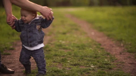 Young dad walking with his son in the park in autumn Stock Footage 55119025
