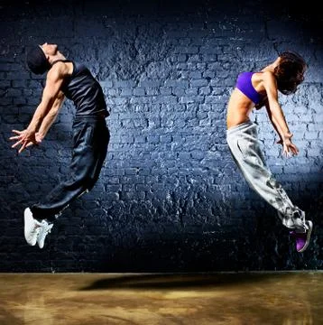 Young dancer couple jumping Stock Photos