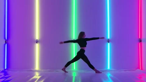 Young dancer demonstrates sensual movements by dancing contemp against backdrop Stock Footage 147552682