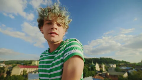 Young dancer performing contemporary outside on the roof. Man enjoying dance Stock Footage 229104359