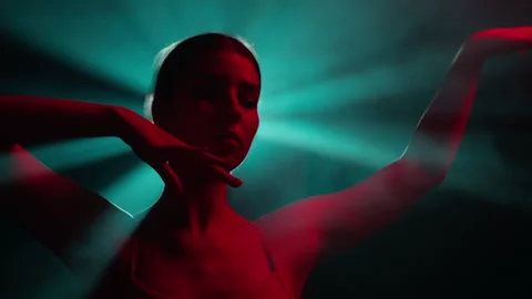 Young dancer performs contemporary dance solo routine on stage Stock Footage 242509870