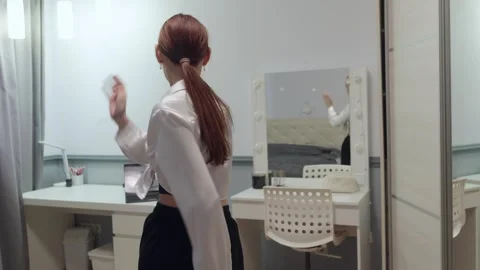 Young dancer practicing modern dance in front of a mirror Video stock 310533799