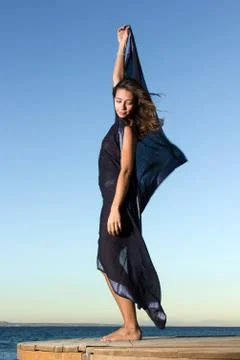 Young dancer with scarf at the beach Stock Photos