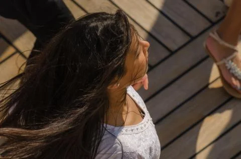 Young dancer in the sun on a ship Stock Photos