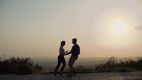 Young dancers couple having fun practising salsa dance in street Stock Footage 133280566