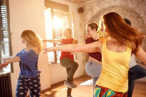 Young dancers dancing in dancing studio Stock Photos