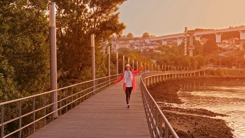 Young dancing woman on footpath in sunset, Porto 動画素材 108510550