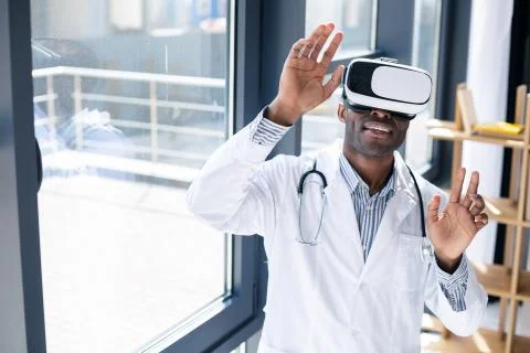 Young dark-skinned man posing on camera Stock Photos