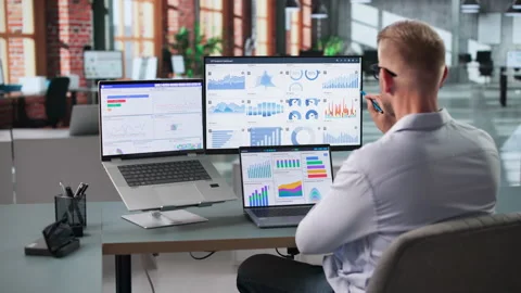Young Data Analyst Reviewing KPIs On Laptop Stock Footage 347280796