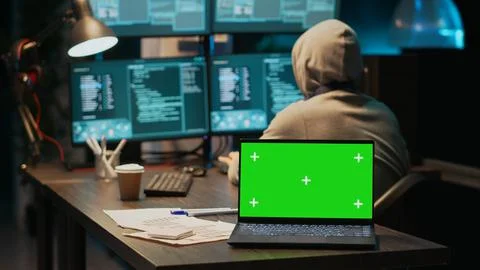 Young data thief using greenscreen to break into IT server 스톡 사진