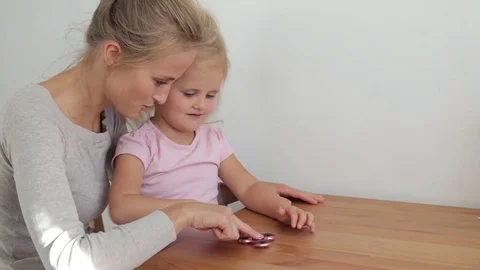 Young daughter with spinner Stock Footage 77213926