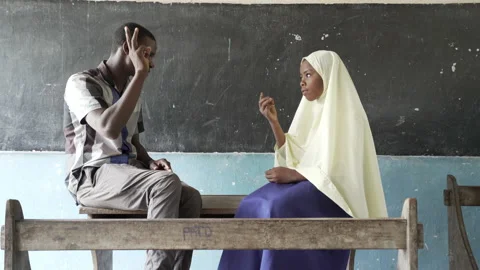 Young deaf school girl learning sign language with her teacher. Stock-Footage 195098997