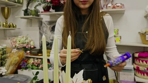 A young decorator prepares interior decoration for the New Year in his workshop Stock Footage 271230768